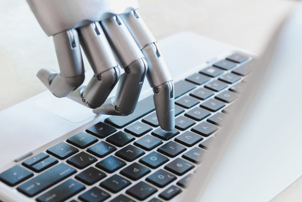 Robot Hands on laptop